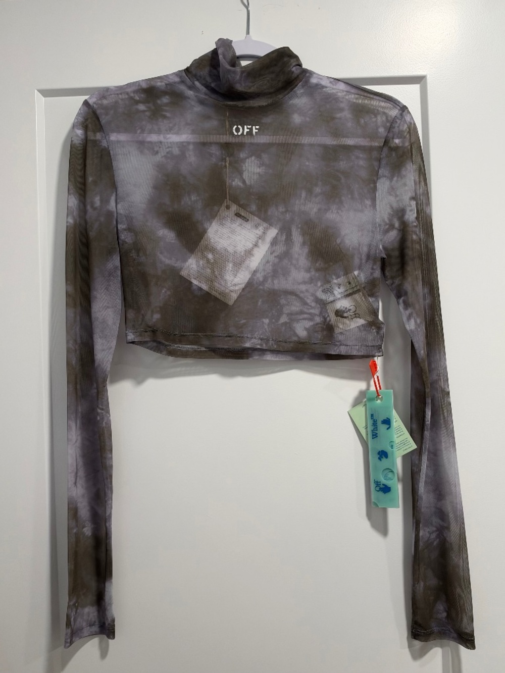 Off-white sheer long sleeve turtleneck crop top